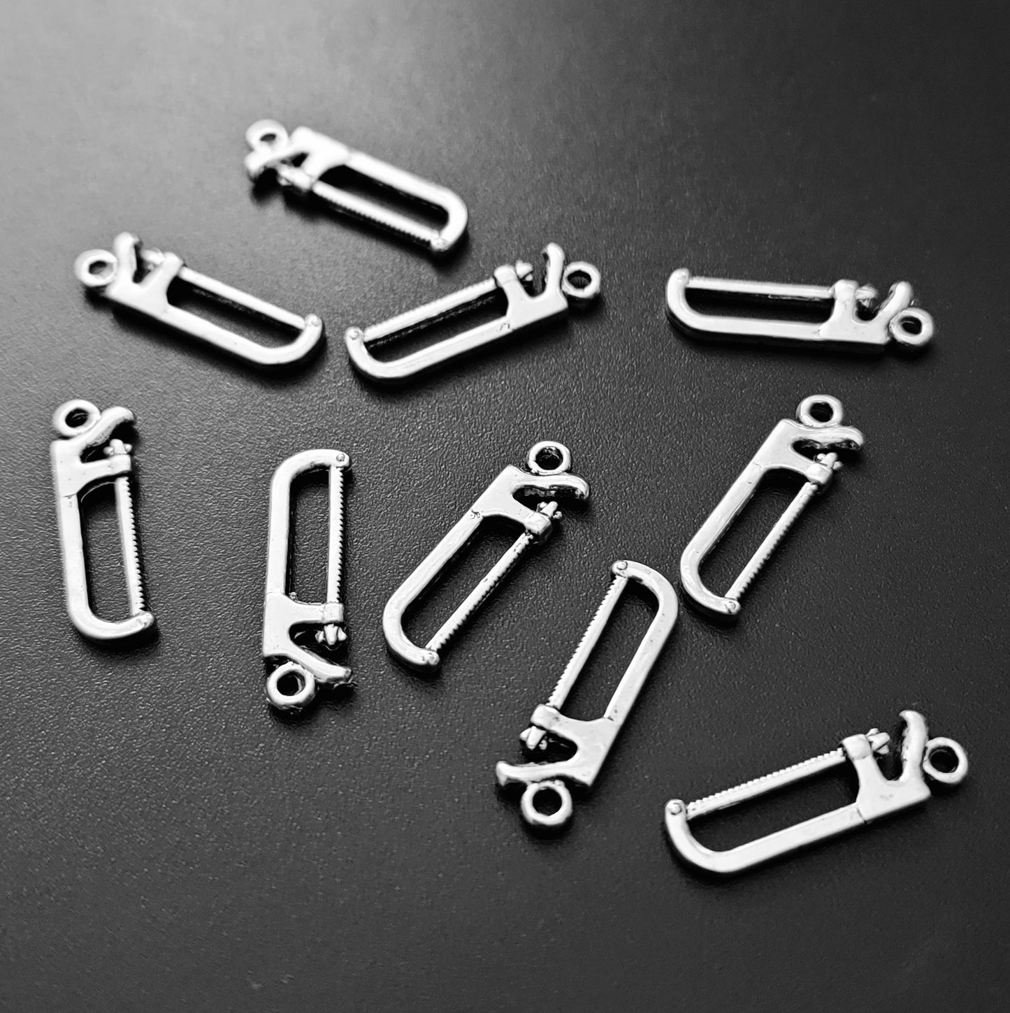 ESC-HT34: Antique Silver Saw Charm: 27x7mm
