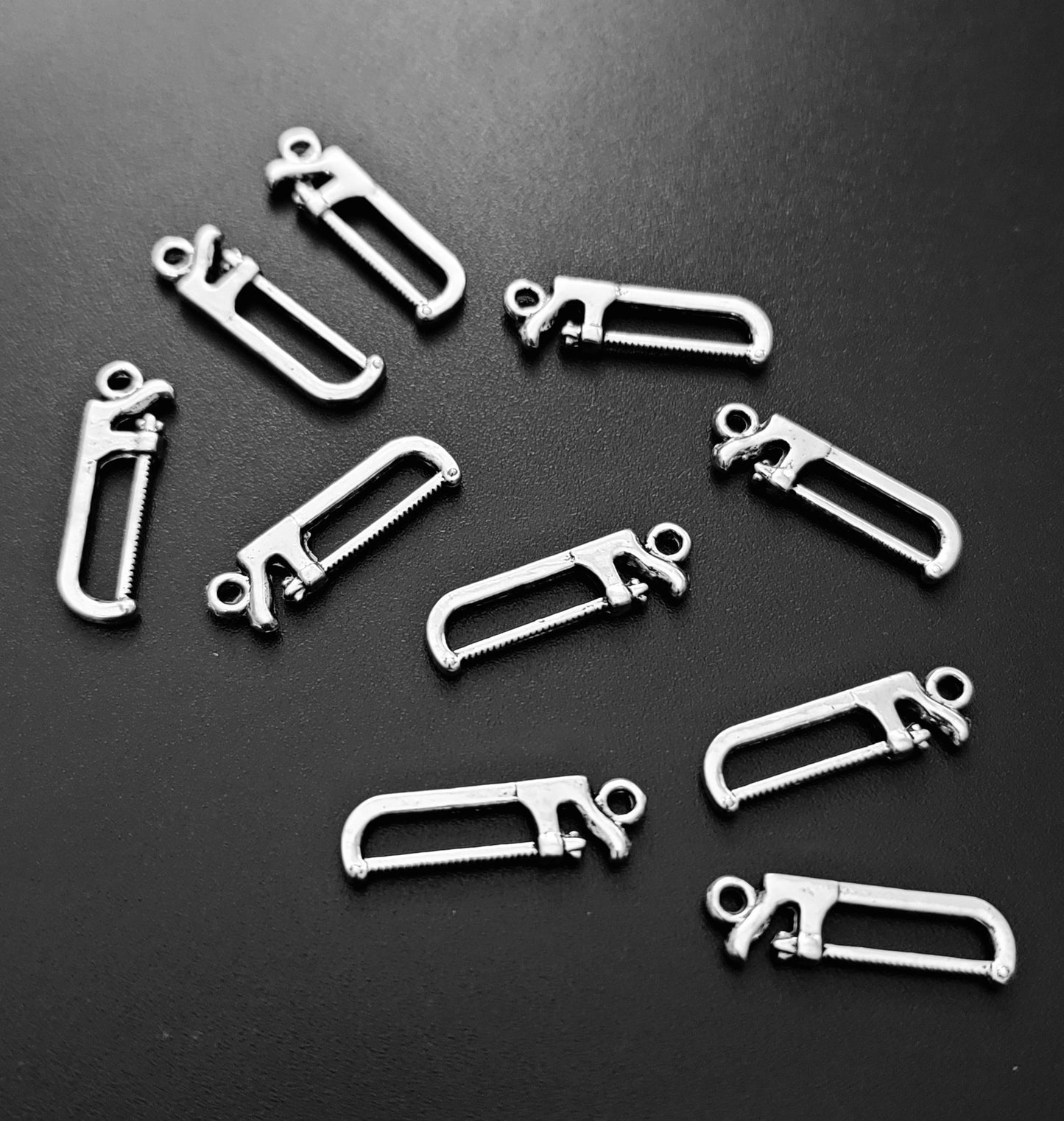 ESC-HT34: Antique Silver Saw Charm: 27x7mm
