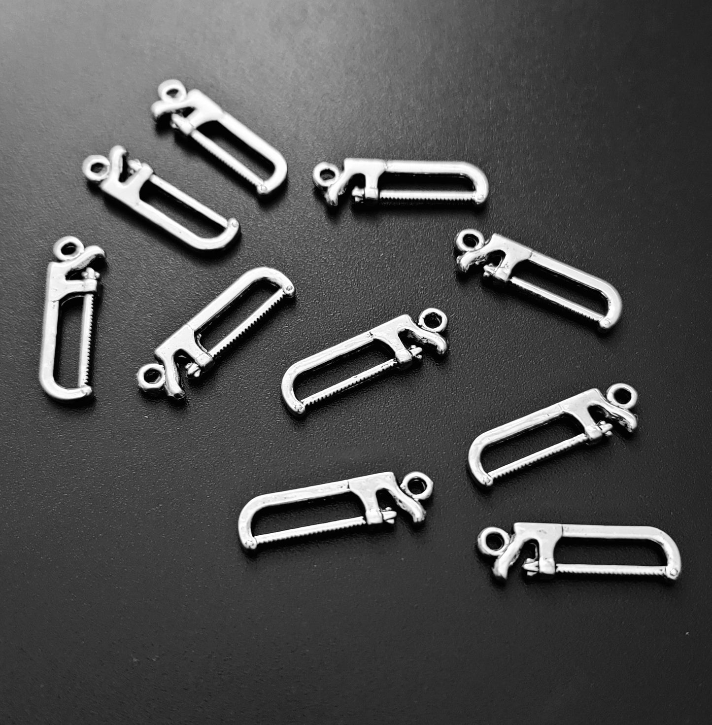 ESC-HT34: Antique Silver Saw Charm: 27x7mm